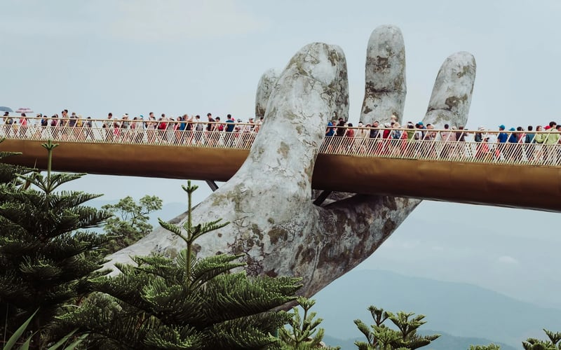 Hand statue near mountain bridge