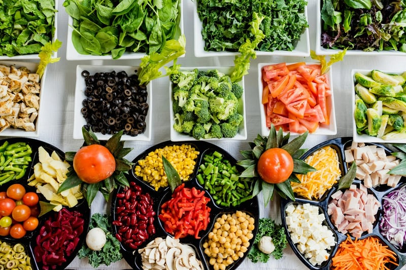 Vietnamese market table with colorful vegetables and fruits